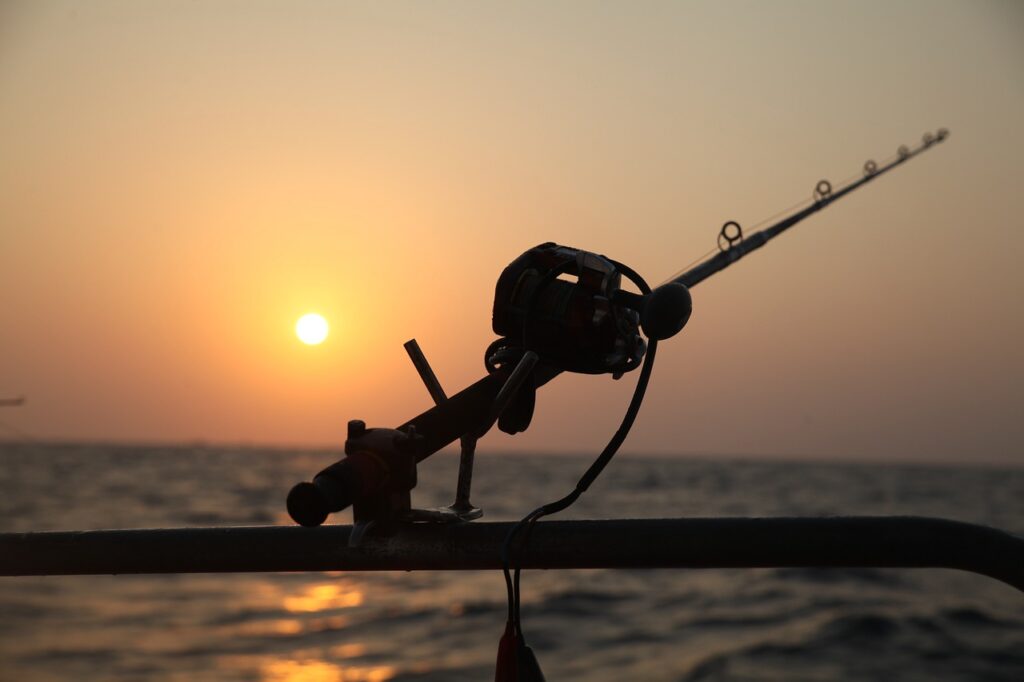 Caña de pescar foto en buena calidad con sol de fondo